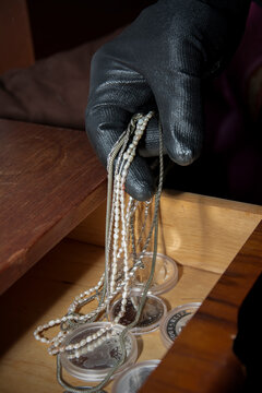 Germany, North Rhine Westphalia, Burglary stealing jewelery and silver coins