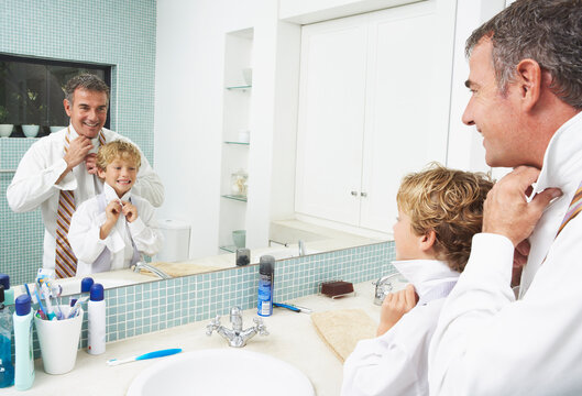 Father and Son Tying Neckties