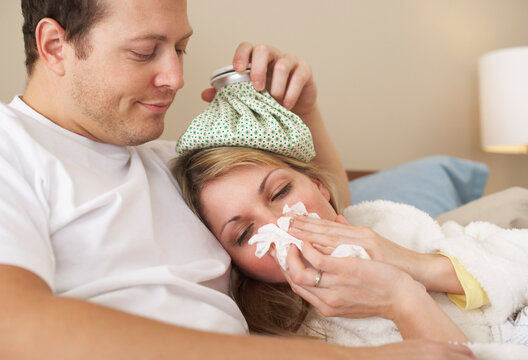Sick Woman Being Comforted