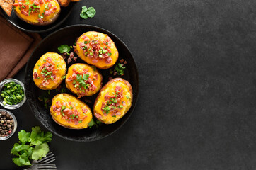 Baked stuffed potatoes with bacon, green onion and cheddar chees