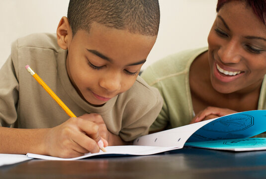Mother Helping Son with Homework