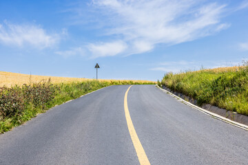 Empty asphalt road and mountains nature scenery in Xinjiang