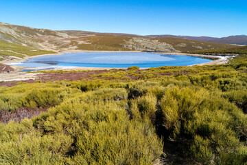 Fototapeta premium Los Peces lagoon in the Sanabria lake Natural Park at sunset in winter, Zamora, Castilla y Leon, Spain.