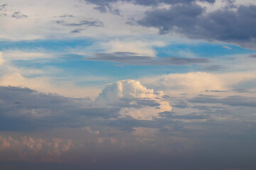 Vast sky landscape adorned with fluffy clouds, showcasing the beauty of nature and evoking a sense...