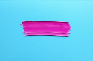 thick pink and purple acrylic oil paint brush stroke on blue background