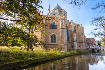Obraz premium Delft, The Netherlands October 15, 2024. The New Church and the canals of Delft.