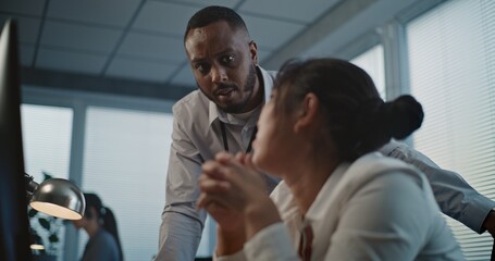 Call center office: Close up of tired Asian female helpdesk specialist holding head, feeling...