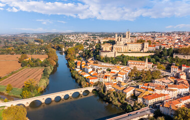 The old bridge and the Saint-Nazaire cathedral on the Orb in Béziers, Occitanie, France
