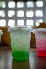 Iced green Italian soda in take a glass, Refresh drink