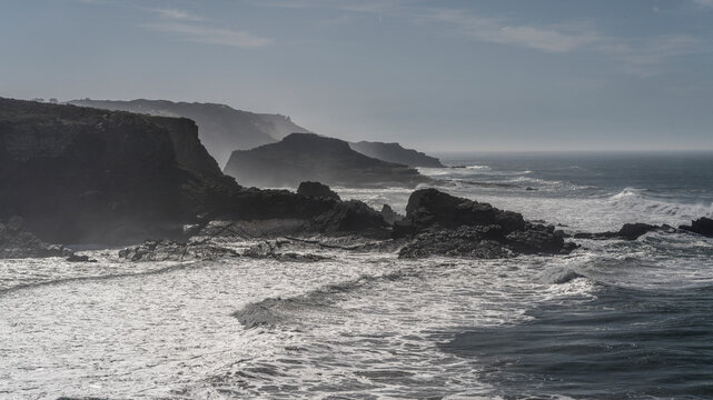 Beautiful cliffs and surf along the coast of Portugal; Zambujeira do Mar, Beja, Portugal