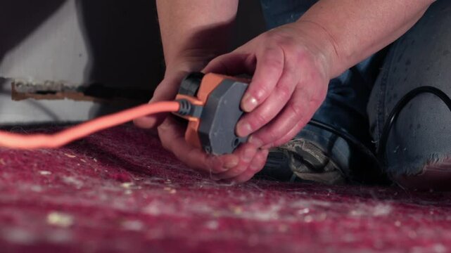 Plugging in electric power extension cable 