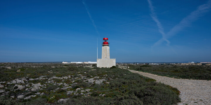 Lighthouse of Ponta de Sagres at the Fortress of Sagres, in the Algarve region of Portugal. Sagres sits at the extreme western tip of the Algarve region; Sagres, Faro, Portugal