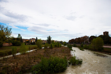 A rushing river in winter floods the city, creating stunning views and highlighting the raw power of nature's elements.