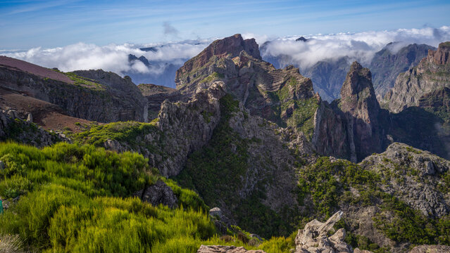 Pico do Areeiro, Madeira island's third highest peak, with the mountain range peaks in the clouds, Portugal; Sao Roque do Faial, Madeira, Portugal