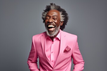 Obraz premium Portrait of a cheerful afro-american man in his 50s dressed in a stylish blazer while standing against plain white digital canvas
