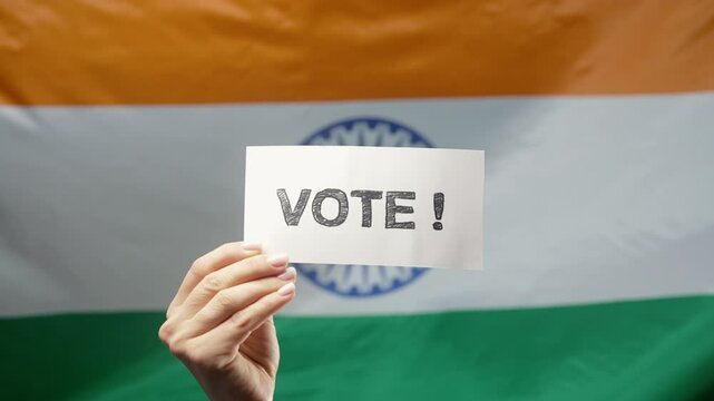 Woman Holds Title Sign With Text Vote, Indian Flag Background, General Elections 