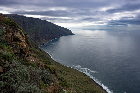 Rugged sea cliffs and ocean view with grey, cloudy sky from Farol da Ponta do Pargo; Ponta do Pargo, Madeira, Portugal