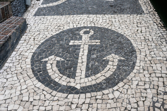 Image of an anchor in the stonework of a walkway; Paul do Mar, Madeira, Portugal
