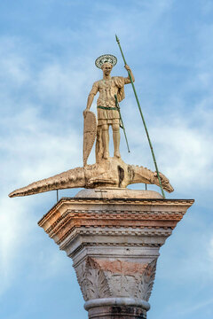 Statue of St Theodore atop a granite column in Piazzetta of St Mark, Venice, Veneto Region, Italy