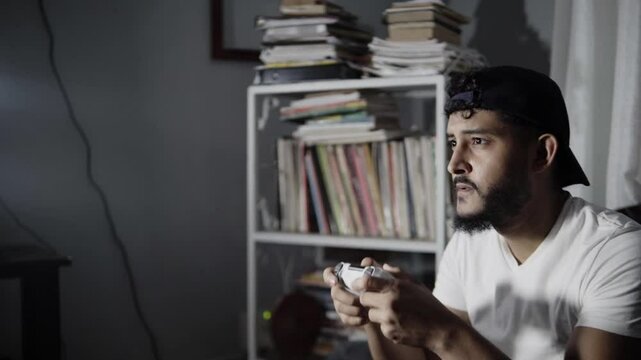 Man fron a TV playing a videogame