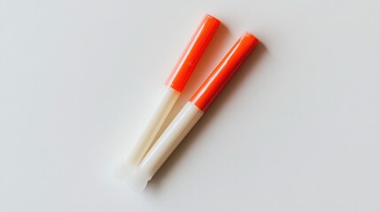 Closed and open glue stick displayed against a white background