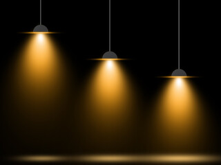 Three suspended light bulbs with a warm, yellow glow, casting soft spotlights against a dark...