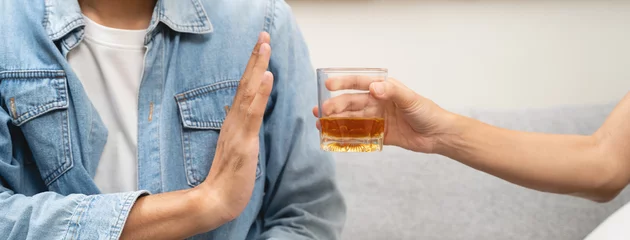 Fototapeten Stop alcohol concept. Person refuse to drink alcohol. © Pormezz