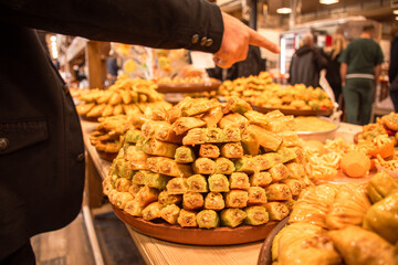 Display of plates full of freshly baked armenian style delight candy deserts in famous Tsovagyugh food court in Armenia