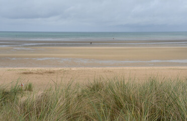 Normandy beaches are known for Operation Overlord and D-Day. Muted colors and immense beaches for low tide, haystacks from the countryside overlooking the Channel.