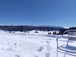 cottage home view on snowscape in the mountains, nice place to sit and have tea