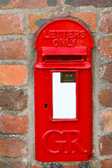 Close up view of a vintage British post box from the reign of King George