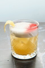 Yellow Cocktail with Foam and Lemon Zest