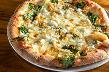 A view of a spinach ricotta pizza.