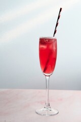 Red Cocktail with Straw and Fresh Strawberry