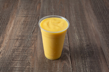 A view of a mango pineapple smoothie.