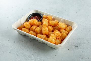 A view of a tray of tater tots.