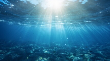 Fototapeta premium Blue ocean surface seen from underwater, sunlight filtering through