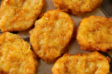 A top down view of some chicken nuggets.
