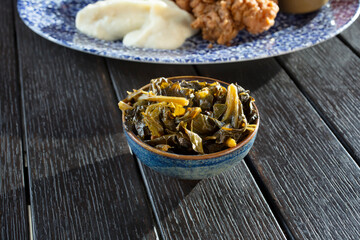 A view of a small bowl of collard greens.
