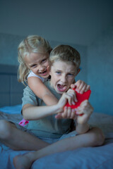 Brother and sister argue and take away the phone. Sibling relationships, greed