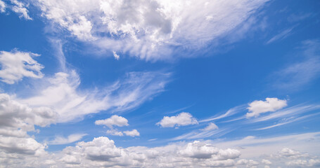 Fototapeta premium clear blue sky background,clouds with background, Blue sky background with tiny clouds. White fluffy clouds in the blue sky. 