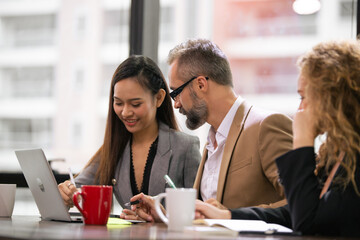 Group of businesspeople having a meeting in the office. Male manager discussing and brainstorming work project with team colleagues. corporate business working together