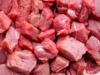 Fresh, red beef goulash cubes. The detailed image is an invitation to cook and is ideal for cookbooks or food blogs.
