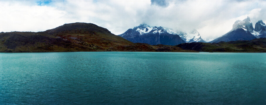 Panoramic image of mountain range overlooking lago pehoe, Torres Del Paine, National Park, Chile, Patagonia, South America..