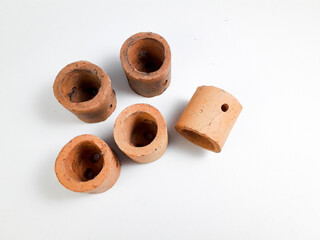 Mini clay pot isolated on white background, this pot is usually used for aquatic plants in aquascapes.