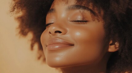 portrait of african american girl with clean healthy skin on beige background.Curly hair in afro style