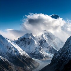 Obraz premium the image shows snow capped mountains with clouds in the sky