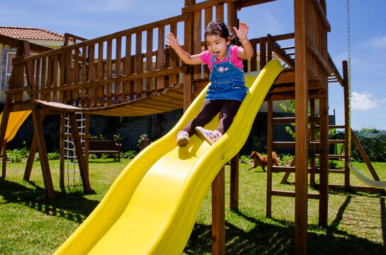 A little child playing on the playground.