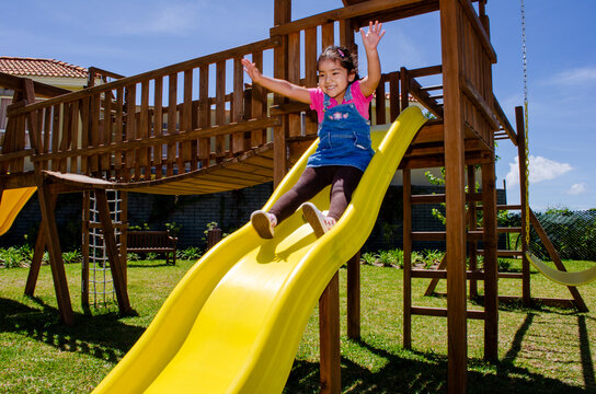 A little child playing on the playground.