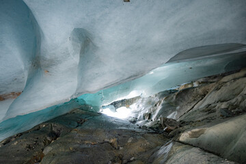Ice cave in the glacier of Langgletscher at Lötschental in Wallis, Switzerland